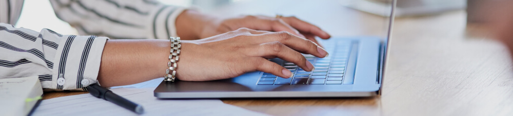 Ladies hands on laptop