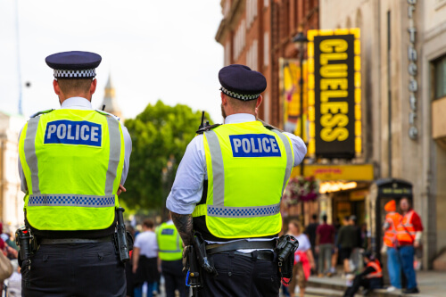 2 UK police officers in a street