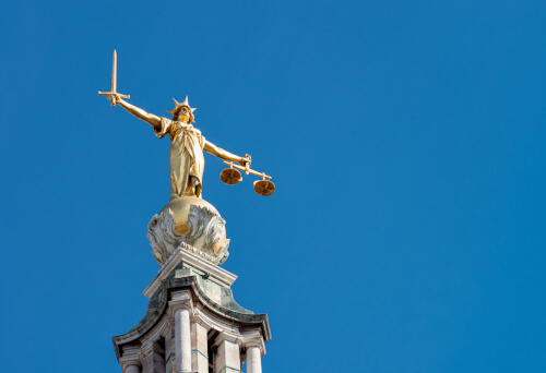 UK law courts with scales of justice