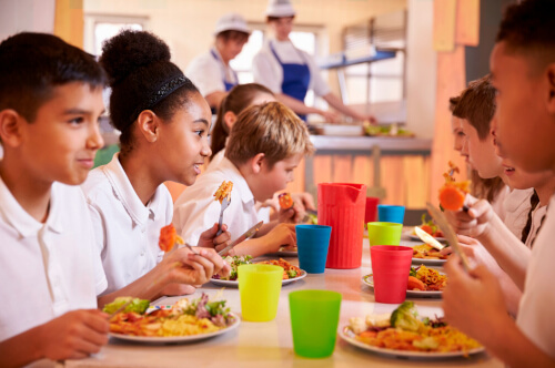 children eating in school canteen