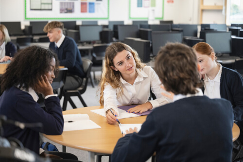 Group of senior school children around a table
