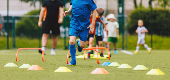 Kids playing football in out of school club