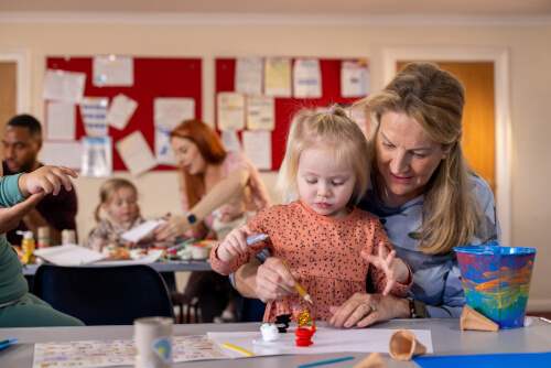 Mother with toddler drawing