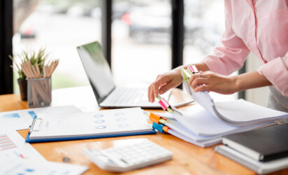 Documents being organised on a desk