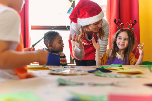 Teacher and pupils in the classroom Christmas