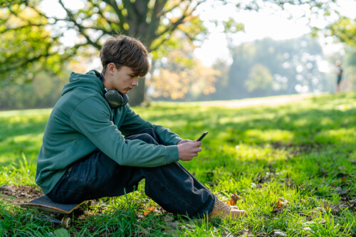 Boy absent from school sat in a park