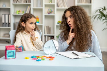 child receiving speech therapy